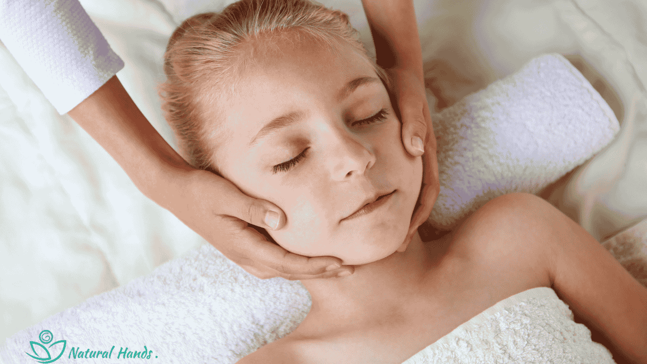 A therapist gently massaging a baby, promoting relaxation and bonding.